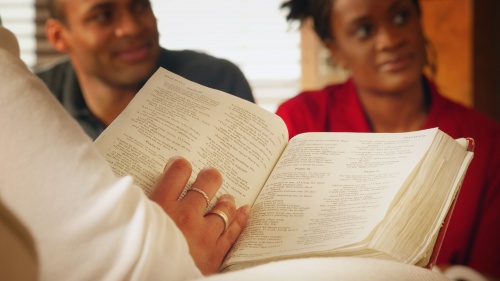 Young people studying the Bible.