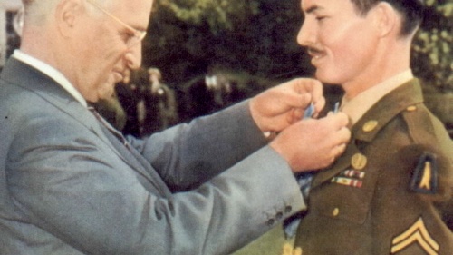 President Harry Truman awarding the Medal of Honor on conscientious objector Desmond Doss.